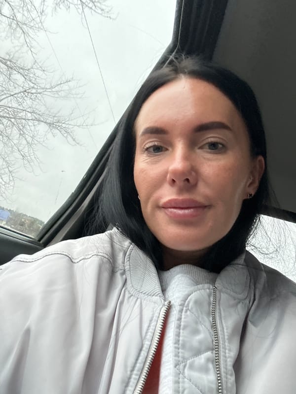 Woman and baby photographed in car in Ольховка, Russia