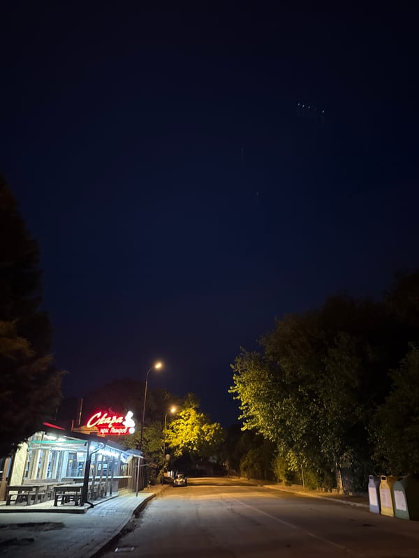 Nighttime stroll past bars, restaurants, and signage in Vidin