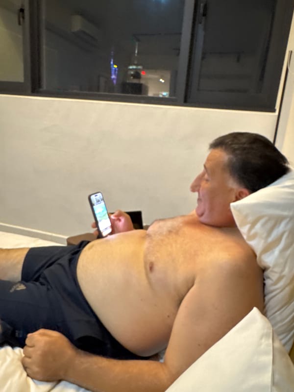 Hotel room downtime in KL: snacks, screens, and city views