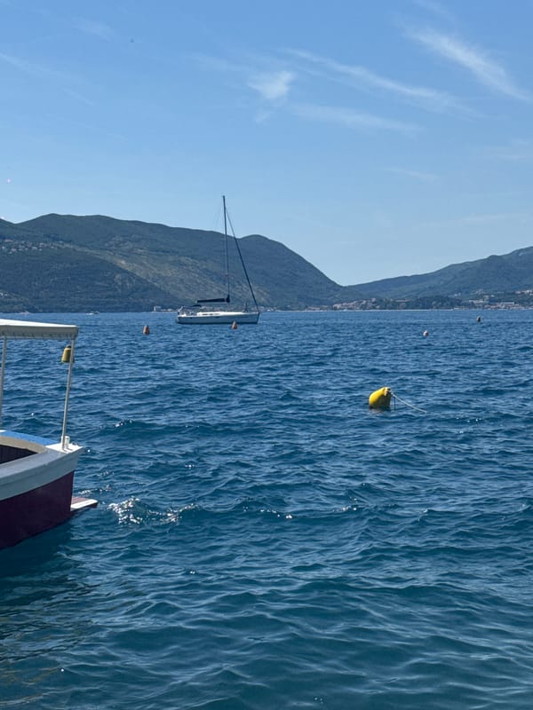 Woman visits Adriatic waterfront, captured in coastal promenade memories