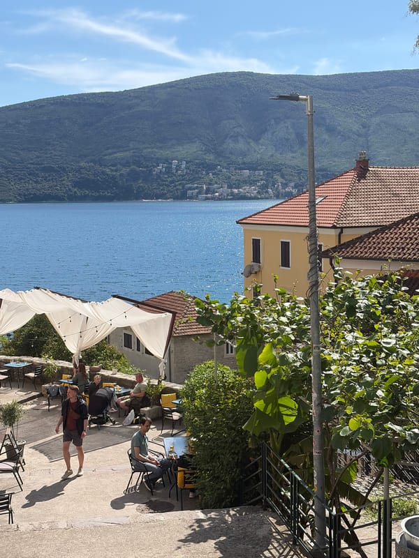 Afternoon cafe scenes and concert setup captured in Herceg Novi