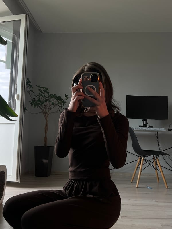 Mirror selfie session in a Ternopil apartment, brown outfit