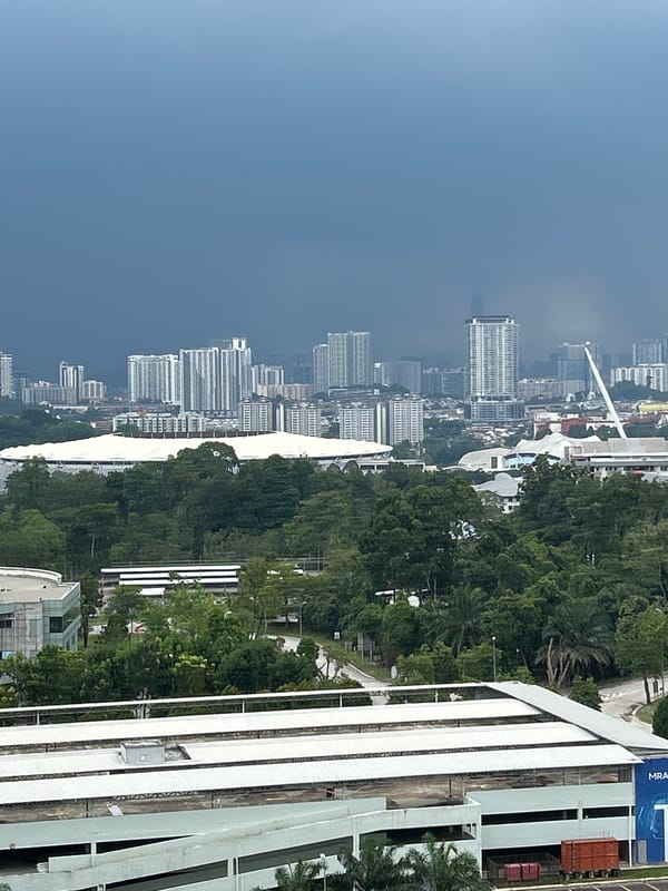 Morning aerial views capture Kuala Lumpur's dense urban skyline