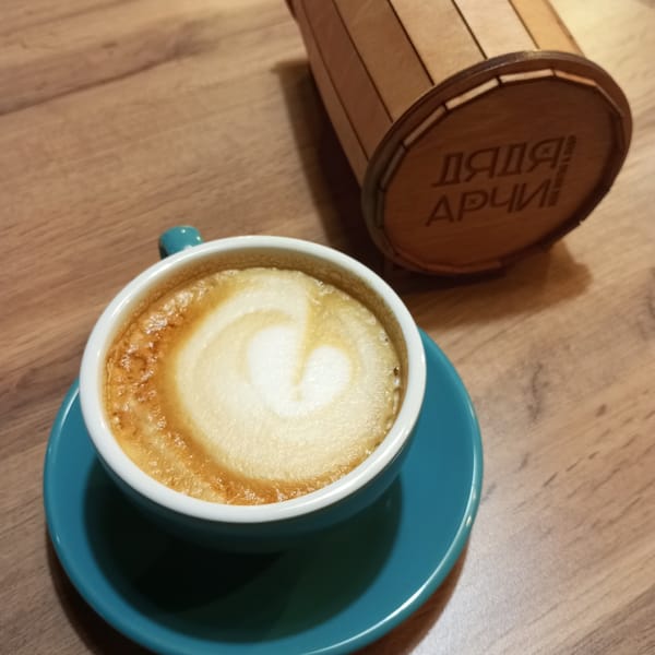 A rainy afternoon around Pervomaysky's apartments, cafés, and sculptures