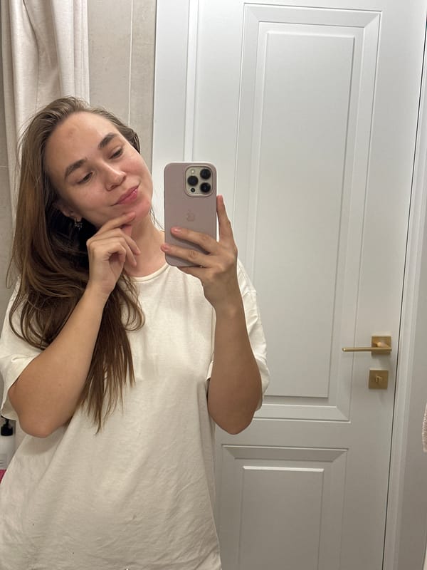 Woman takes selfies with dragon plushie in Kharnavy bathroom