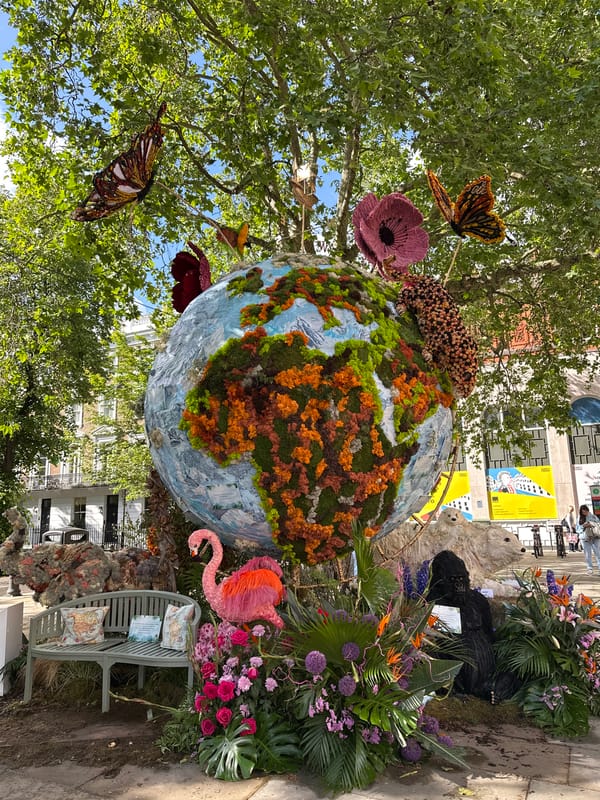 London street scenes feature globe sculpture, decorated RIXO storefront