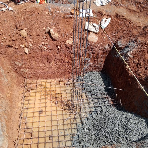 Construction workers lay foundations at Kenya building site