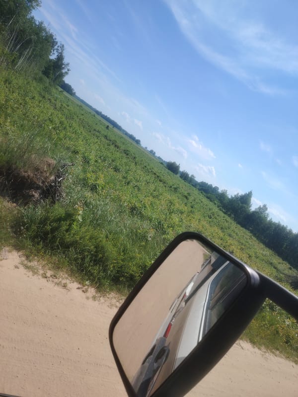 Driving through rural Latvia on a clear summer morning