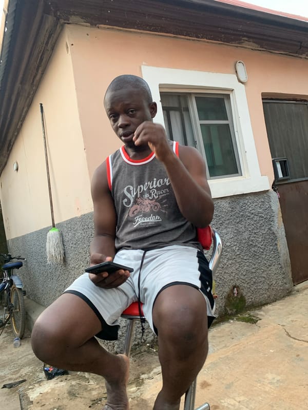 Residents gather with smartphones in Abuja residential area