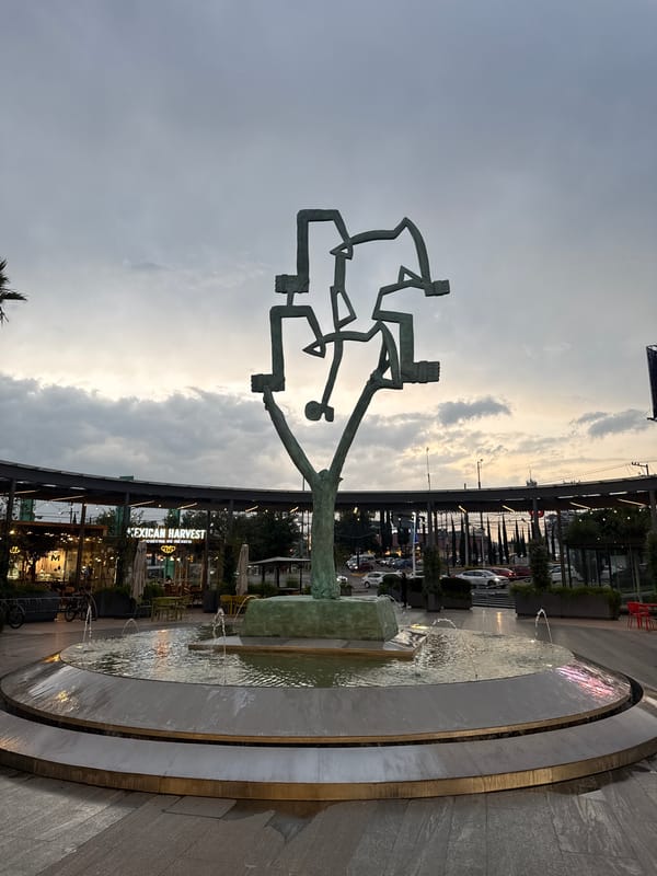Modern sculpture and fountain observed in Puebla public space