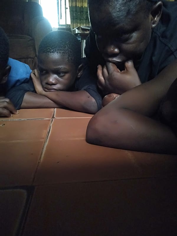 Children rest indoors during afternoon in Shangisha, Nigeria