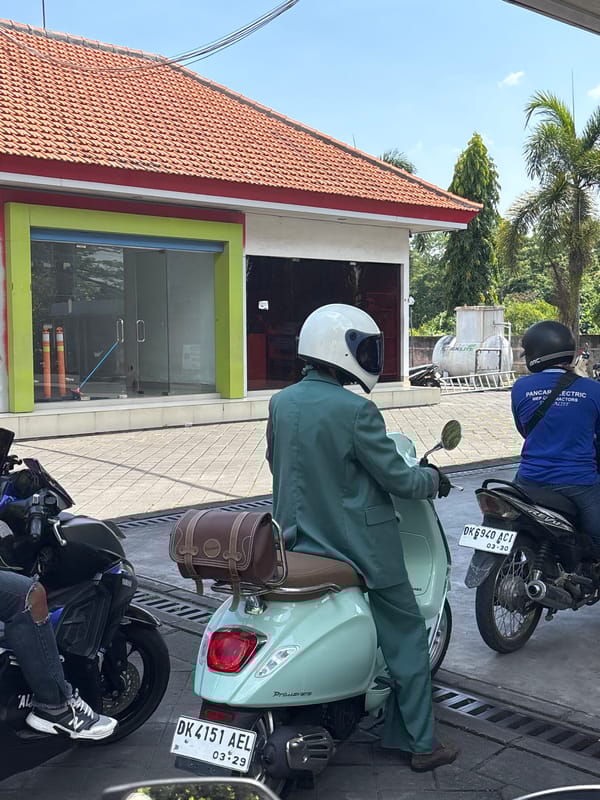 Morning motorcycle queue forms at Mengwi gas station