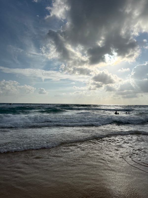 Morning at Karon Beach: waves, cloudy skies, and local surroundings