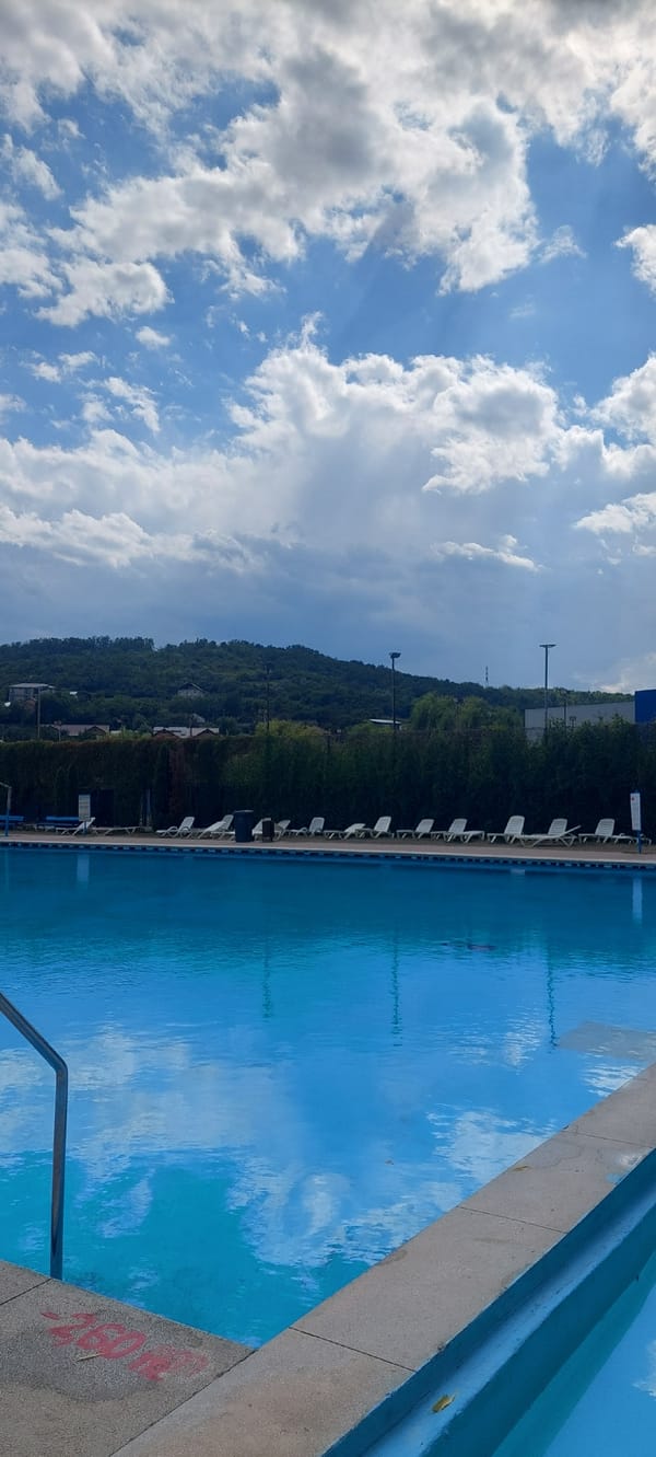 Lazy summer afternoon at an outdoor pool in Iași