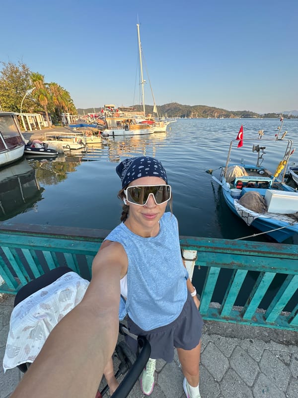Fethiye harbor: fishing boats, calm water, pier selfie