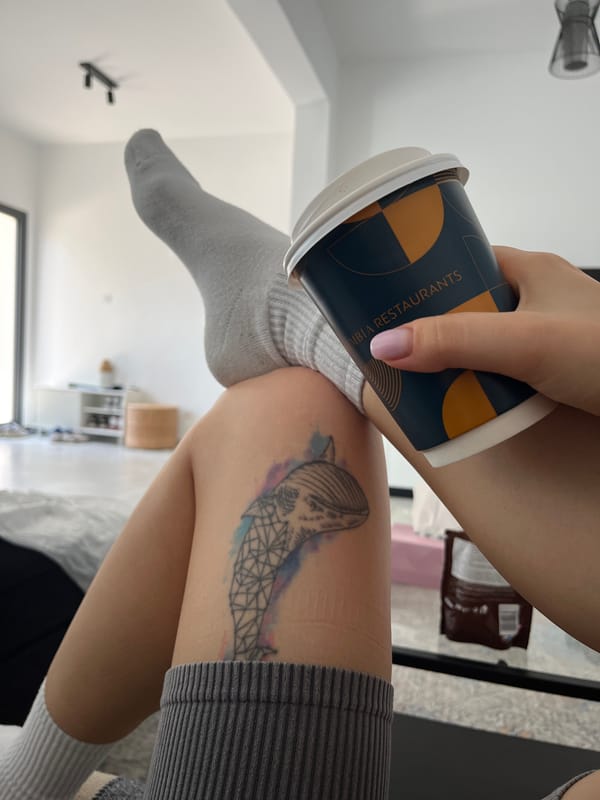 Woman enjoys morning coffee on couch in Limassol