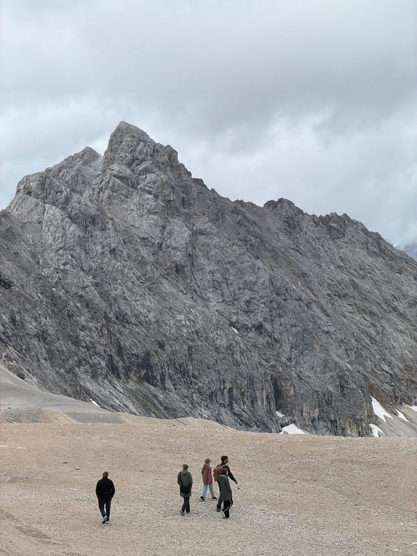 Hikers and a mountain chapel on rocky terrain near Garmisch-Partenkirchen