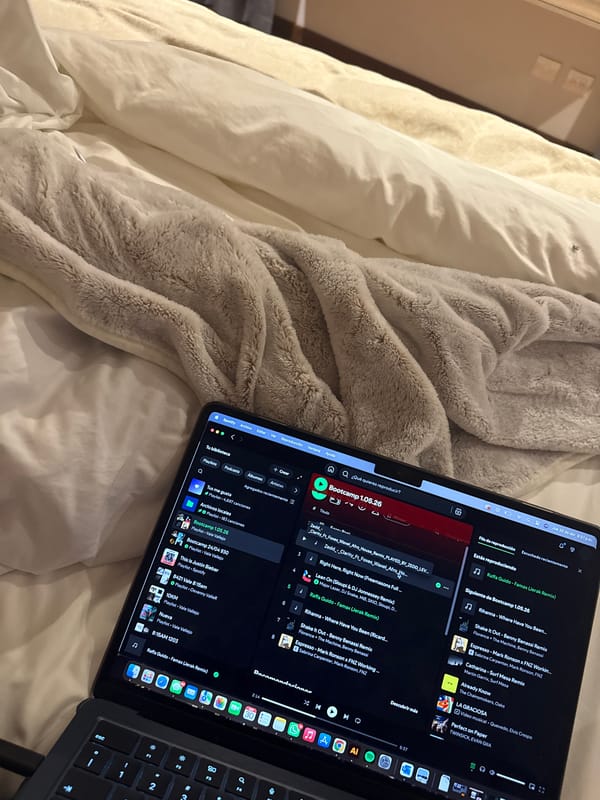 MacBook with Spotify captured on bed in Mexican bedroom