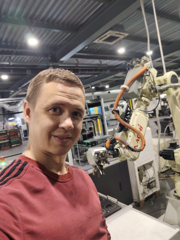 Man takes selfie with industrial robotic equipment in Russia