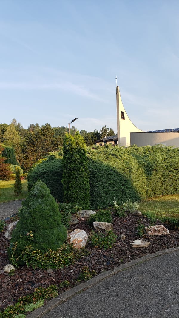 Sunny stroll through a church park in Prešov, Slovakia