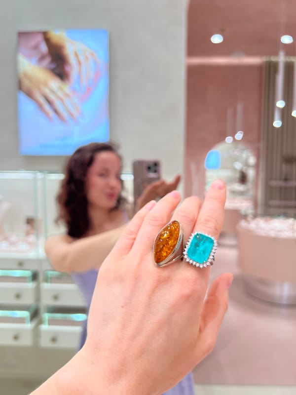 Trying on rings at a jewelry store, selfies included