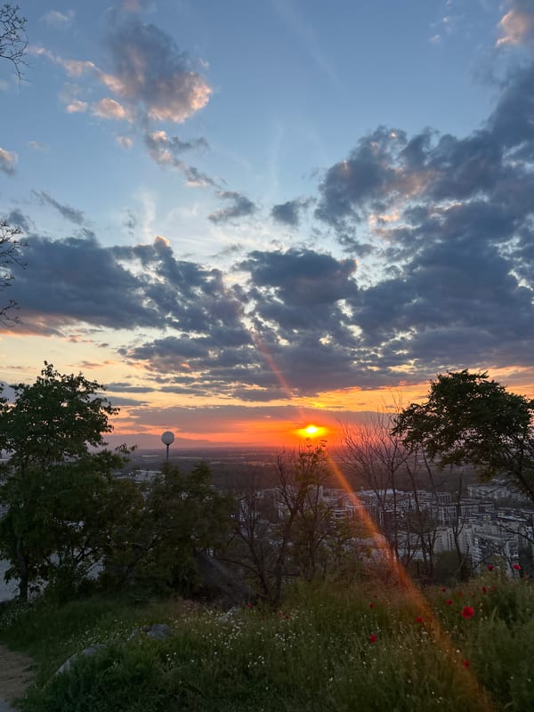 Dramatic sunset captured over Plovdiv from historic hilltop viewpoint
