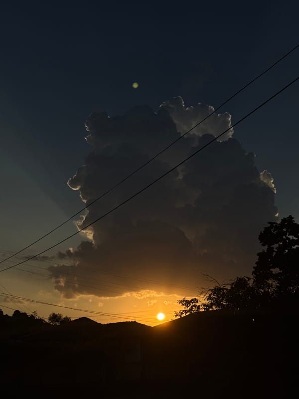Storm cloud backlit by setting sun over central Bulgaria