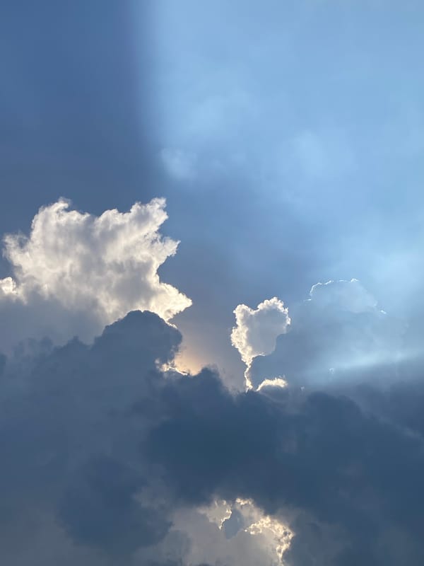 Sunlight breaks through scattered clouds over Ho Chi Minh City