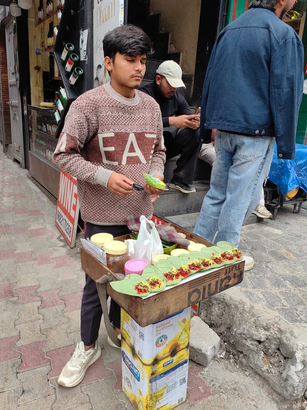 Street vendors and morning traffic in Manali's mountain market
