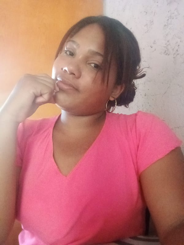 Woman takes multiple selfies indoors in Las Tejerías, Venezuela