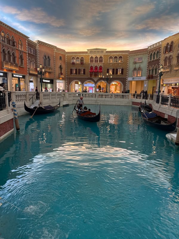 Tourist Documents Venetian Macao's Indoor Canal System During Morning Visit