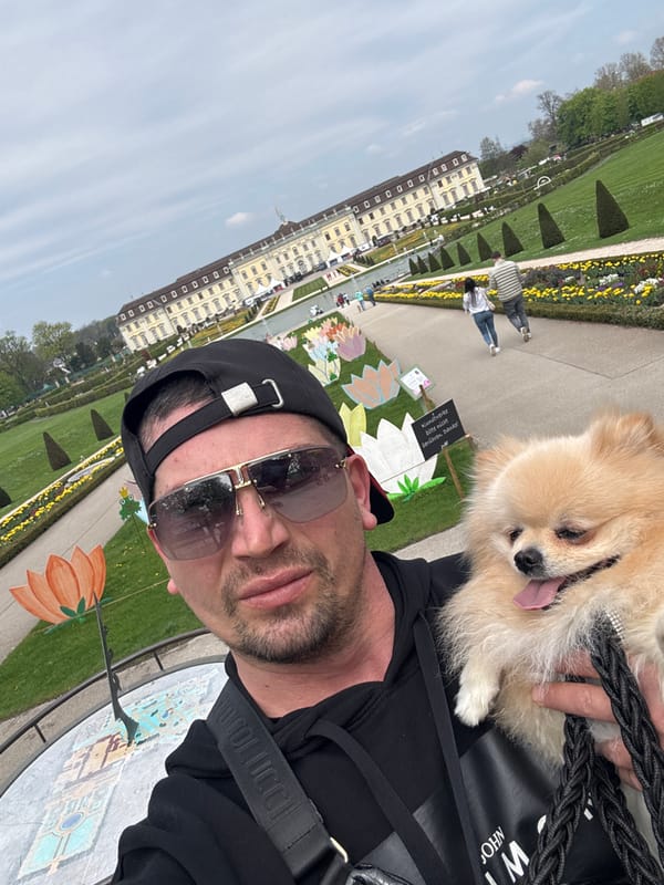 Man takes selfie with Pomeranian at Ludwigsburg Palace