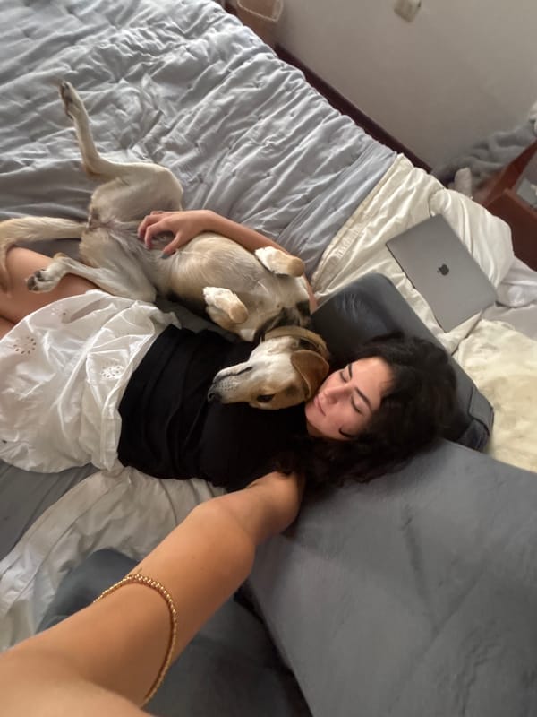Woman rests with dog in Puebla home