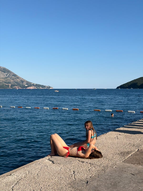 Swimmers and sunbathers enjoy Budva's Adriatic waterfront
