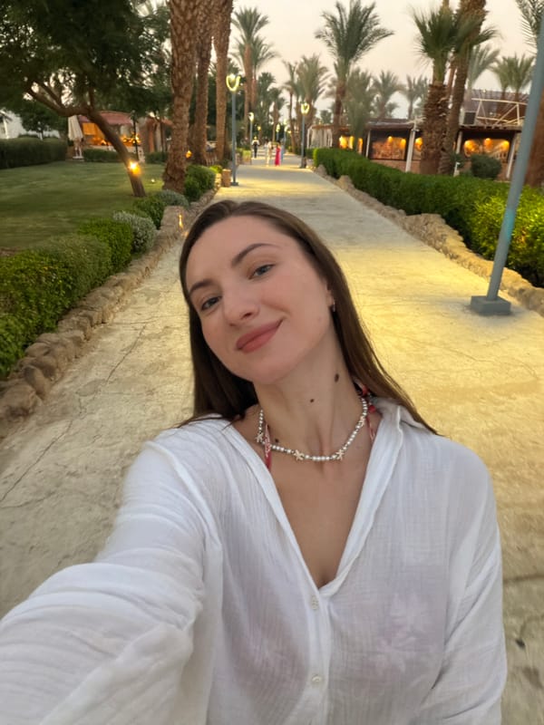 Sharm El Sheikh resort strip at dusk, shops and dining active
