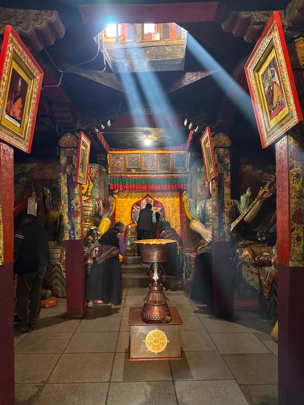 Buddhist temple interior documented with ornate decorations and sunlight