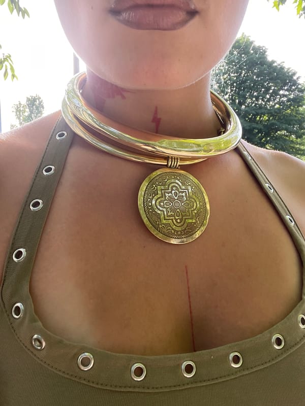 Person in Celtic jewelry, lightning tattoo spotted in Paris