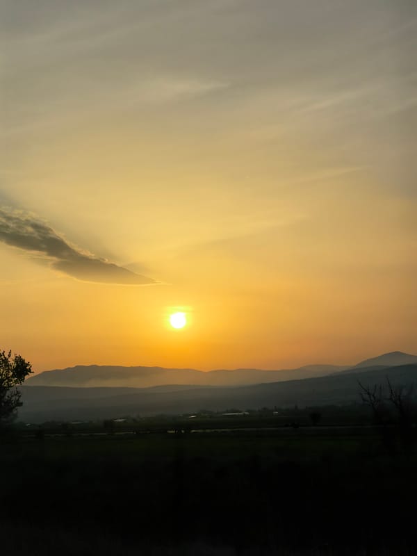 Sunset observed over mountains from multiple locations April 14