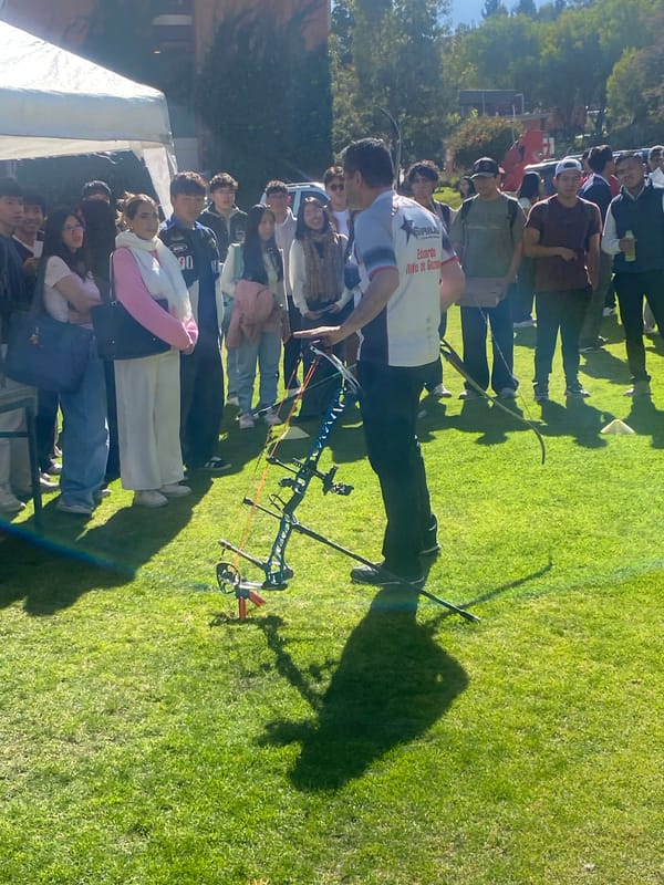 Archery instructor teaches young people bow techniques in Bolivia