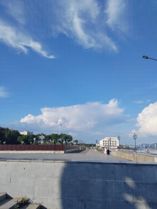 Sunny morning stroll along the Amur River promenade