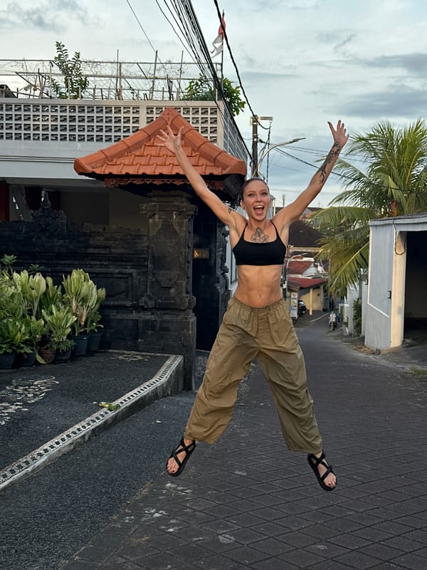 Tourist photo session captured on Dalung streets with local architecture