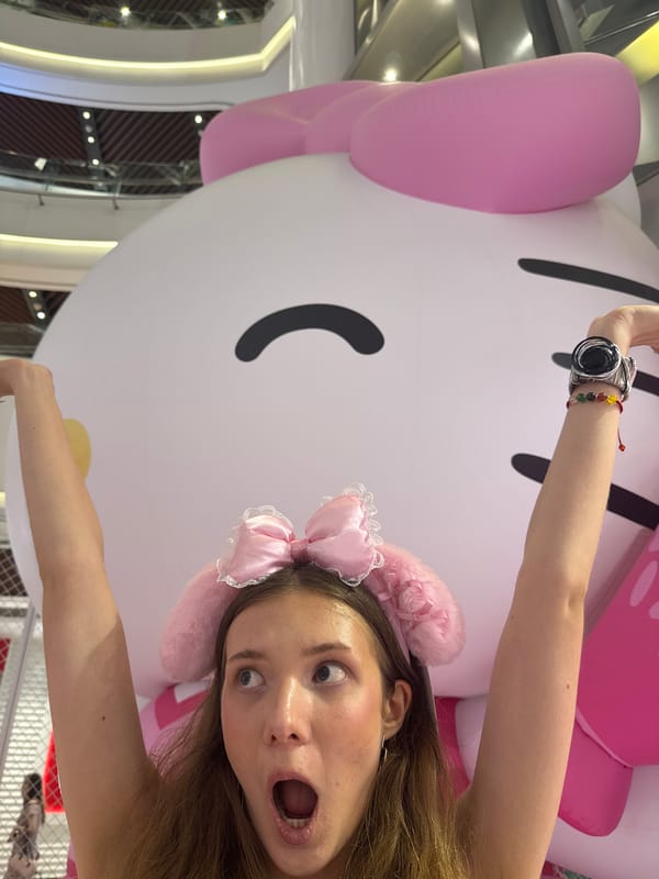 Visitors pose with Hello Kitty display, dine at Shanghai mall