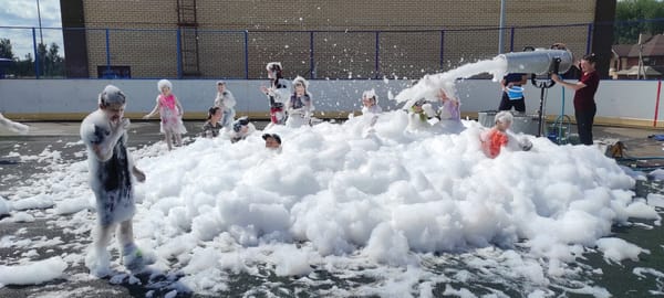 Foam party and water games at an outdoor facility in Noviy
