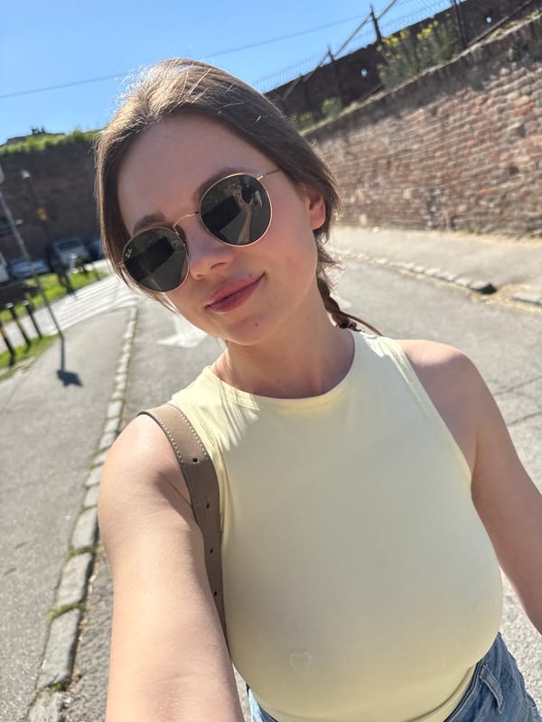 Woman takes selfie near blooming tree in Belgrade