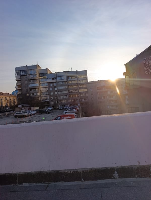 Sunny day street scenes documented across Krasnoyarsk, Russia