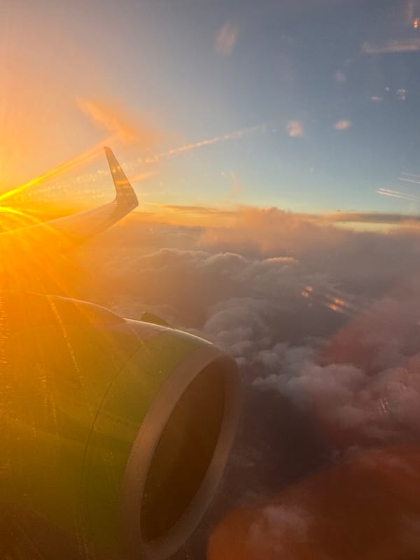 Passenger documents sunset flight views over Mexico City