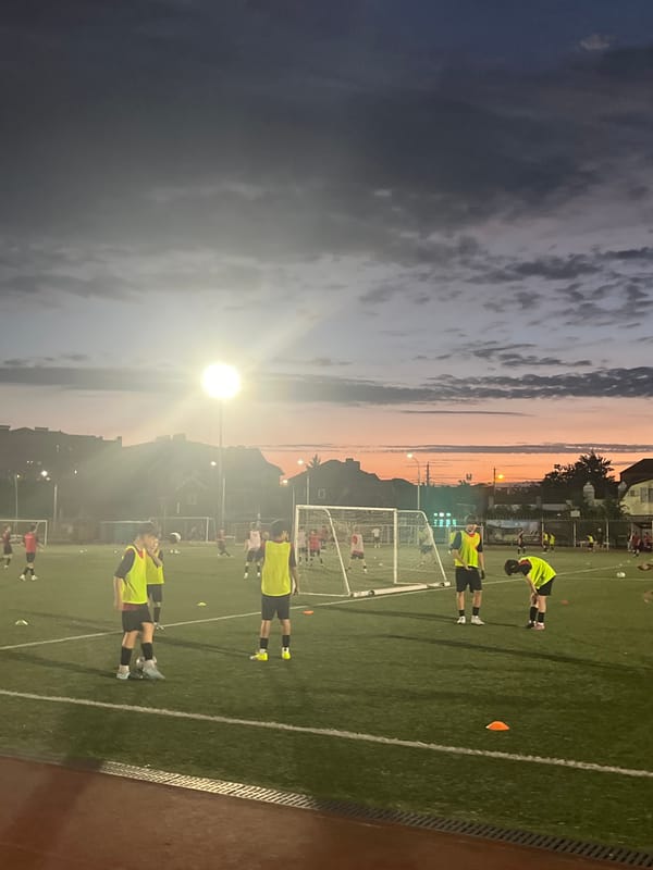 Youth soccer under the lights at dusk in Krasnodar