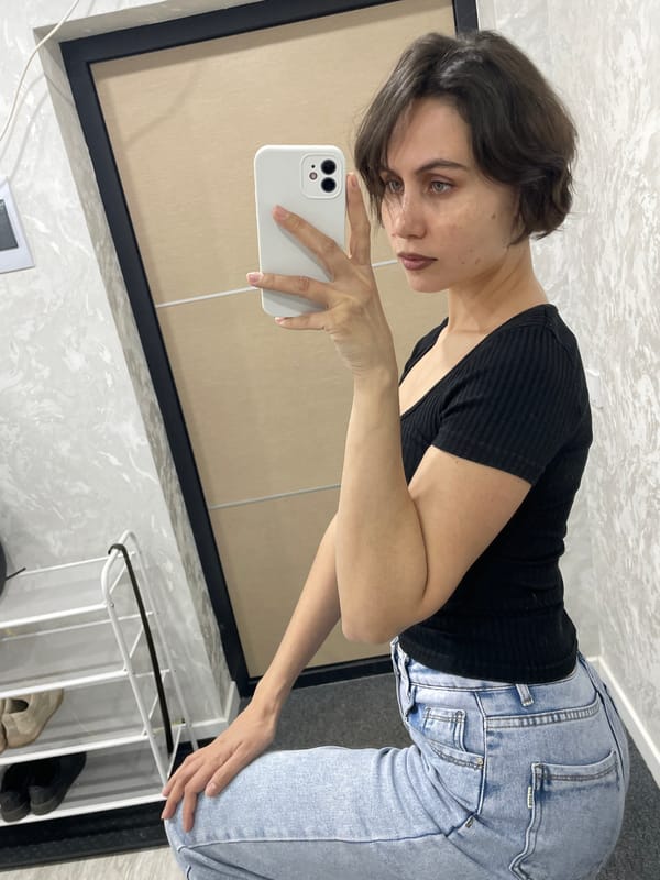 Woman takes mirror selfies in yellow outfit, Izhevsk