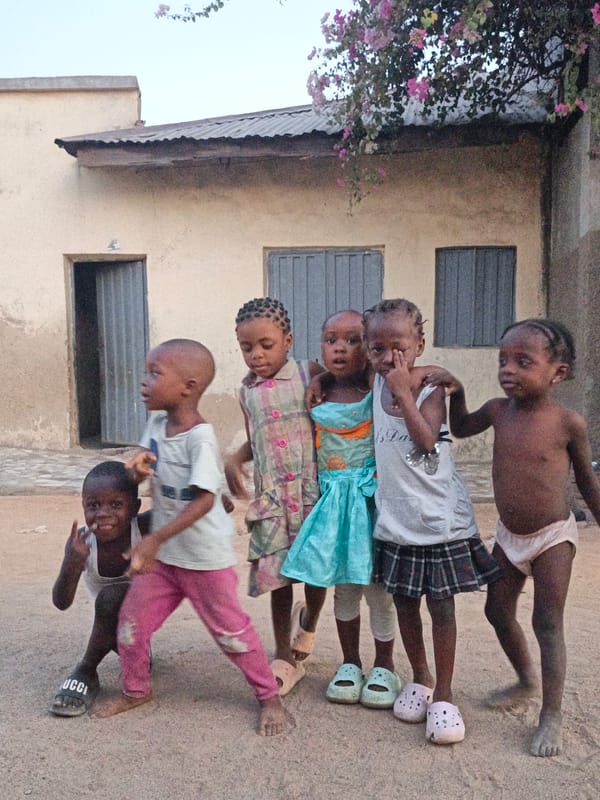Children gather and play outdoors in Gwagwarwa, Nigeria