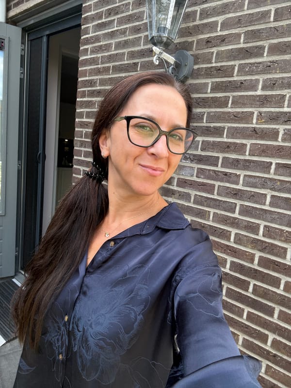 Sunny afternoon selfies outside a brick building in Marum